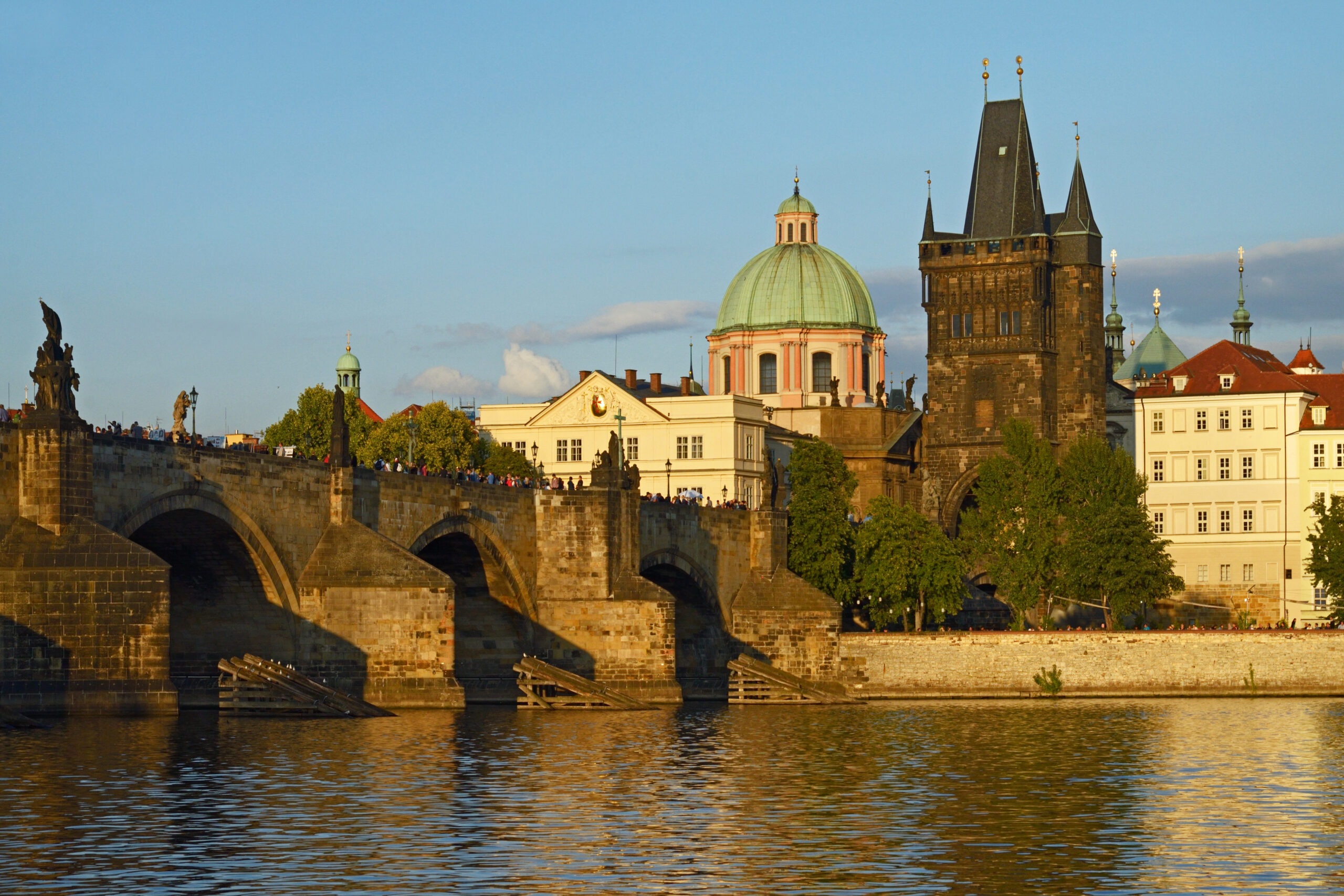 Charles Bridge and Prague's Old Town skyline at golden hour