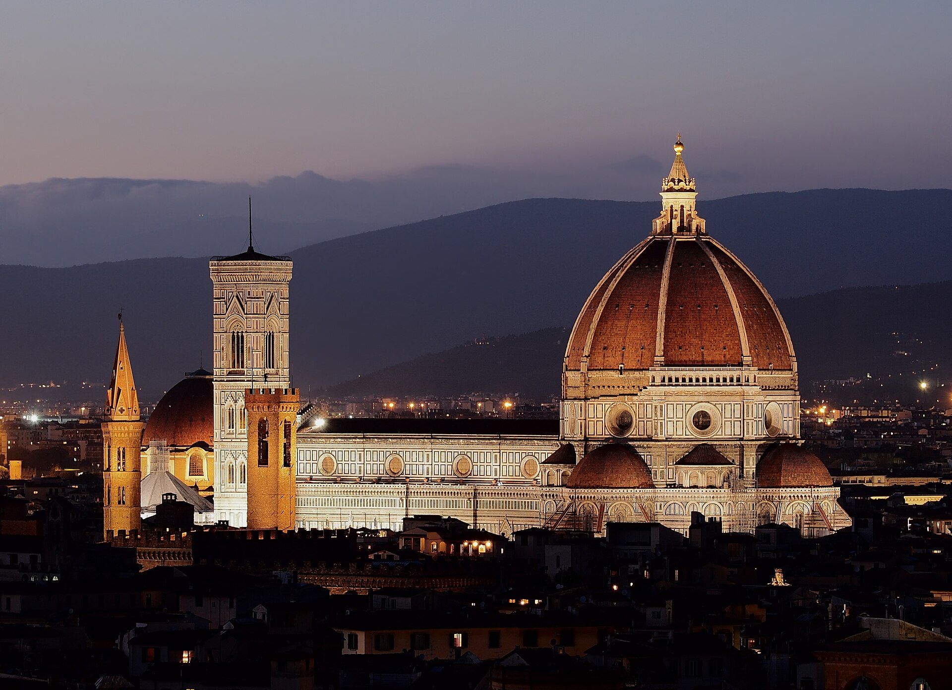 Florence Duomo and Giotto's bell tower rising over the city, seen from Piazzale Michelangelo