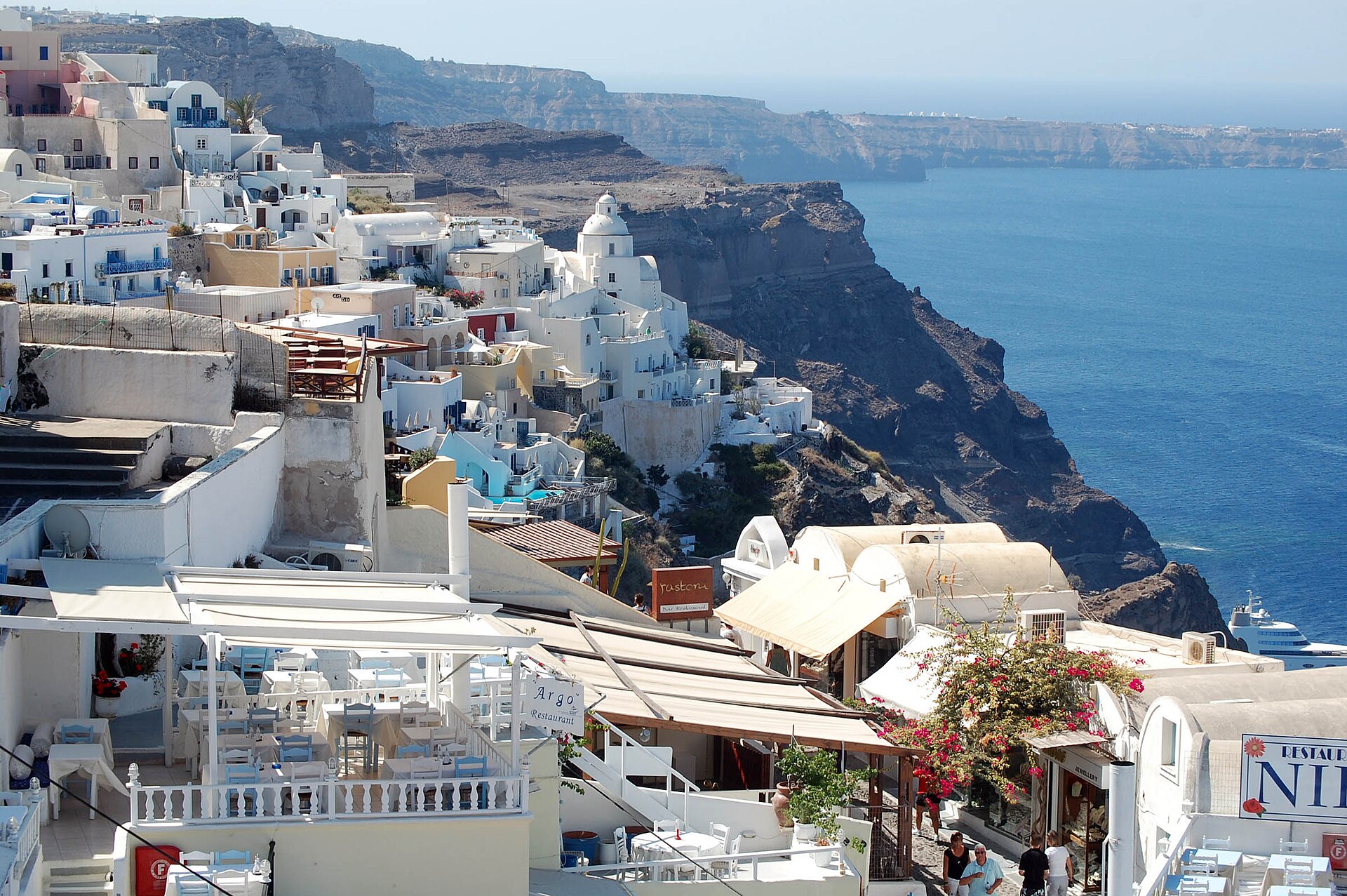 Santorini where to stay: Oia's blue domes overlooking the caldera