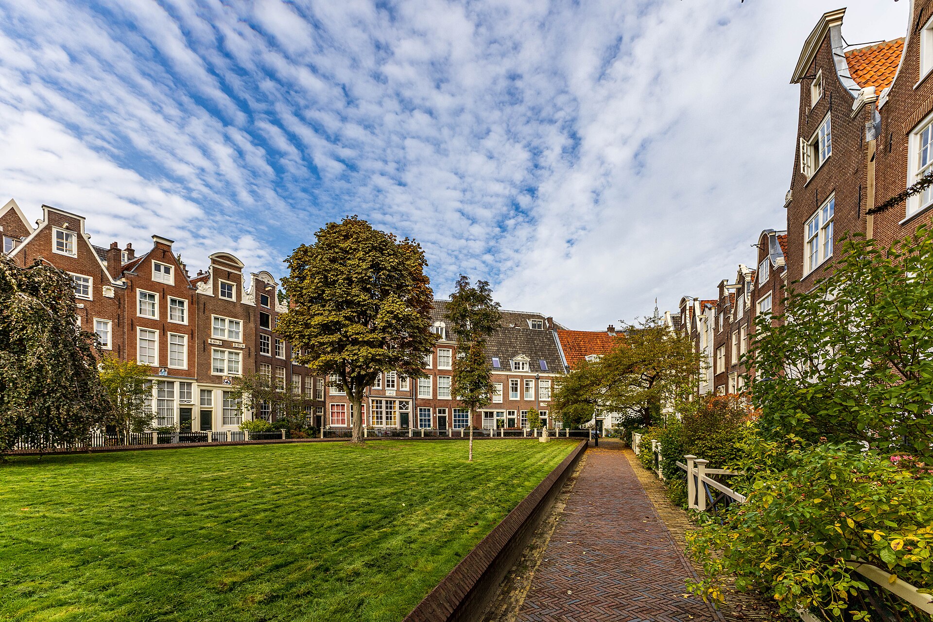 Begijnhof courtyard in Amsterdam with historic houses around a central green