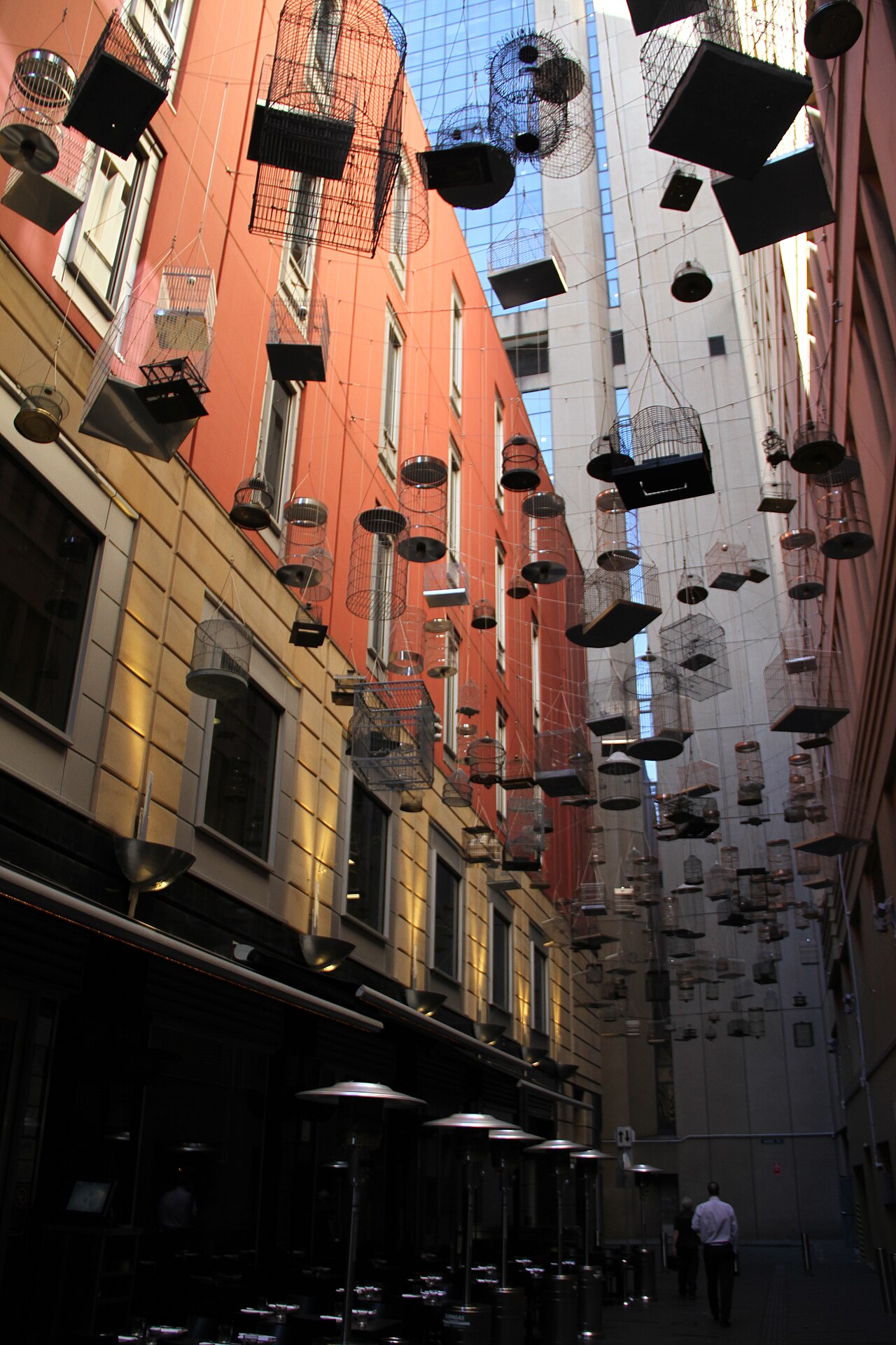 Suspended birdcages of the Forgotten Songs art installation above Angel Place laneway in Sydney
