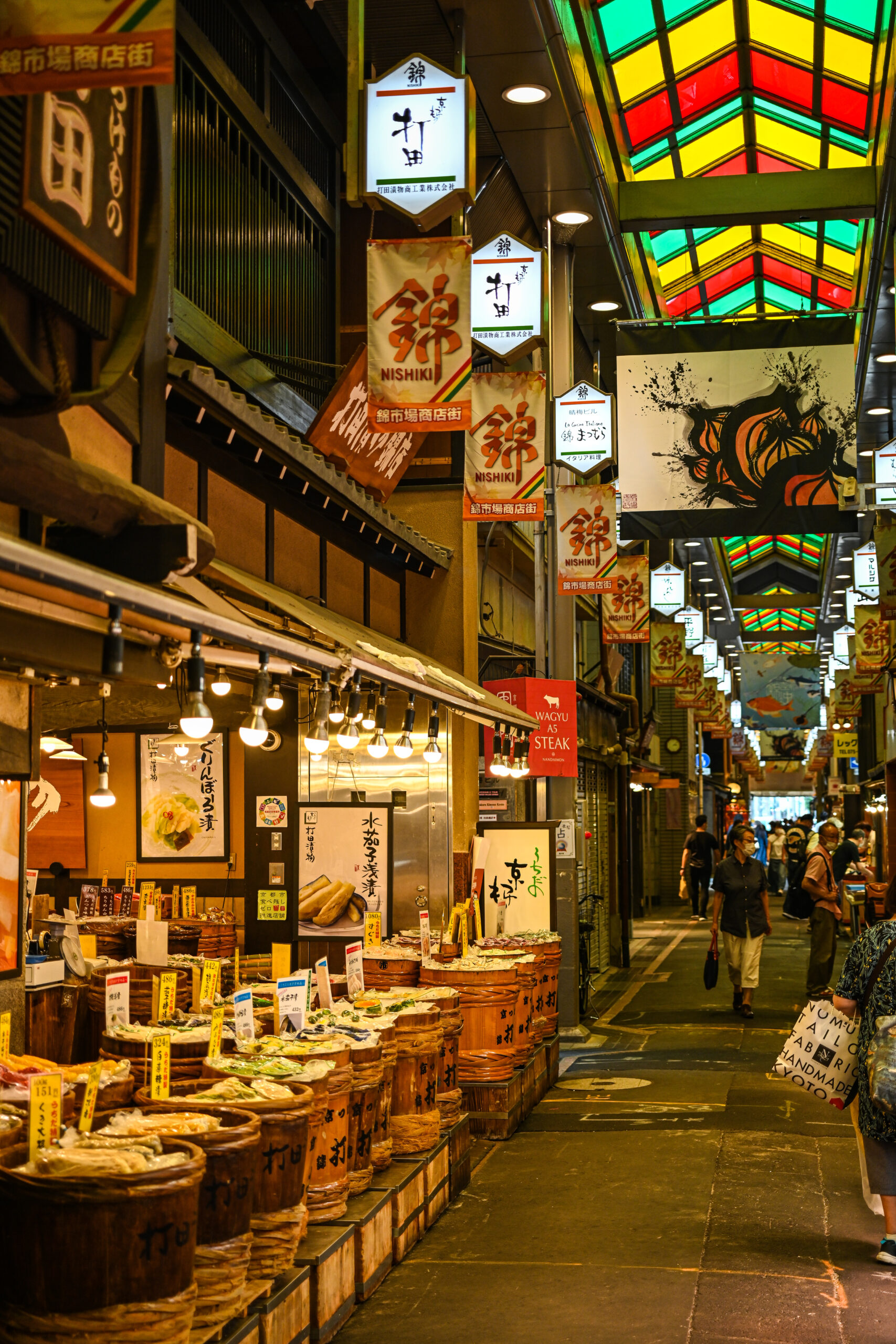 Stalls and shoppers at Nishiki Market, Kyoto
