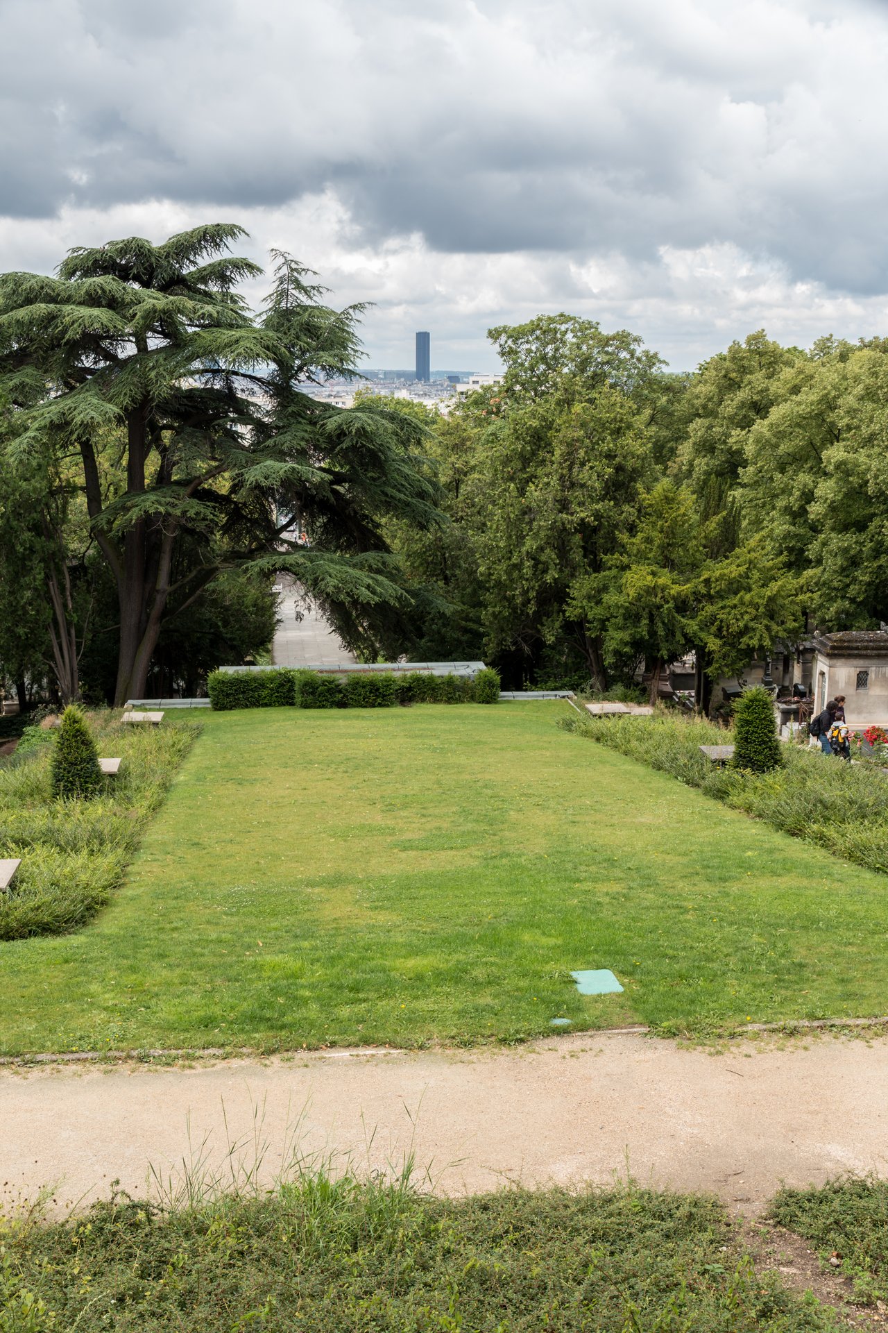 Tombs among trees at Père Lachaise Cemetery, Paris