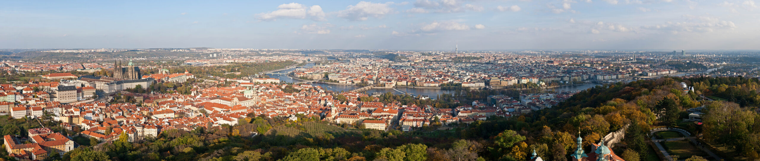 Panoramic view of Prague's rooftops and spires from the Petřín Lookout Tower