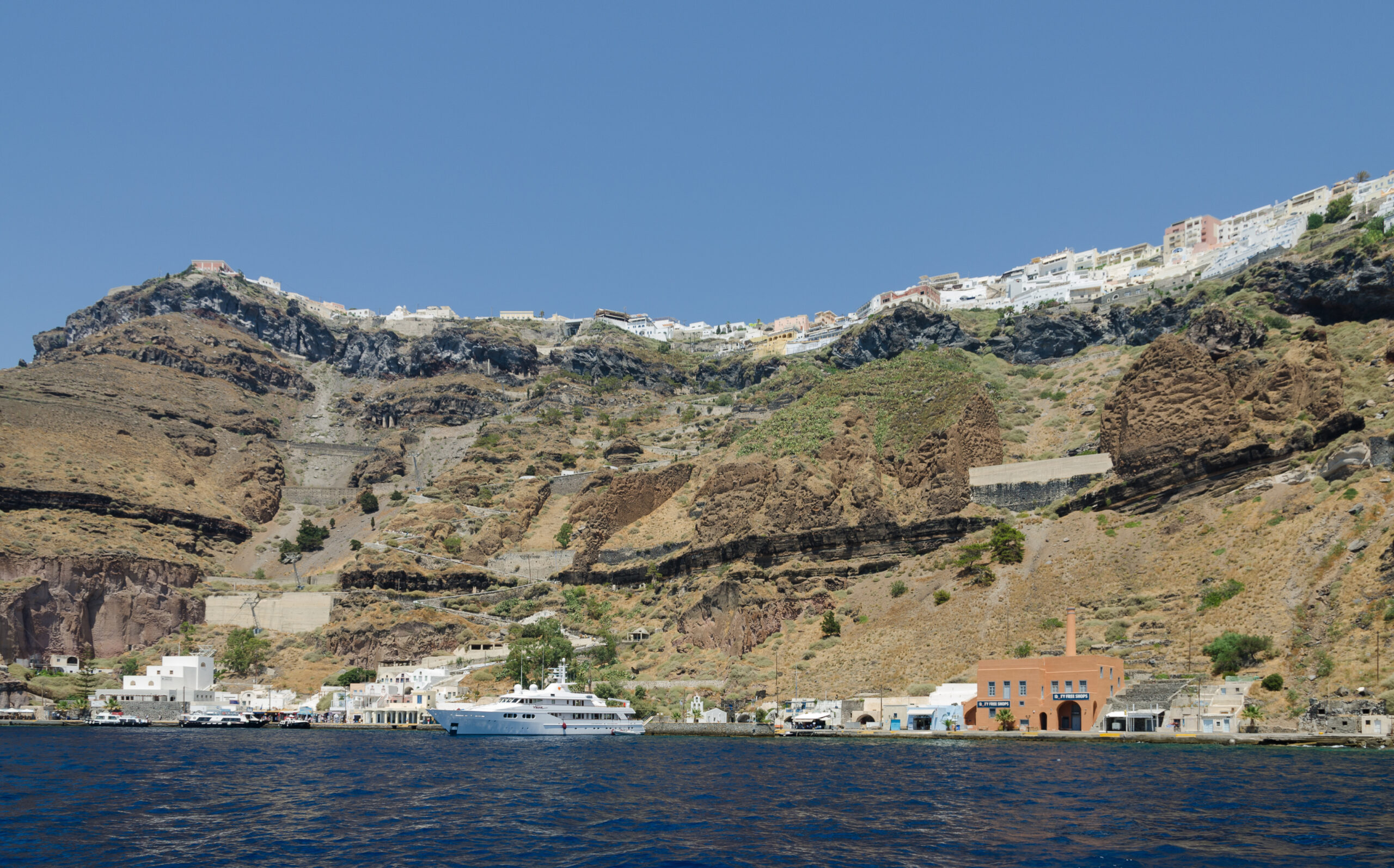 Fira and the caldera rim seen from the water, Santorini