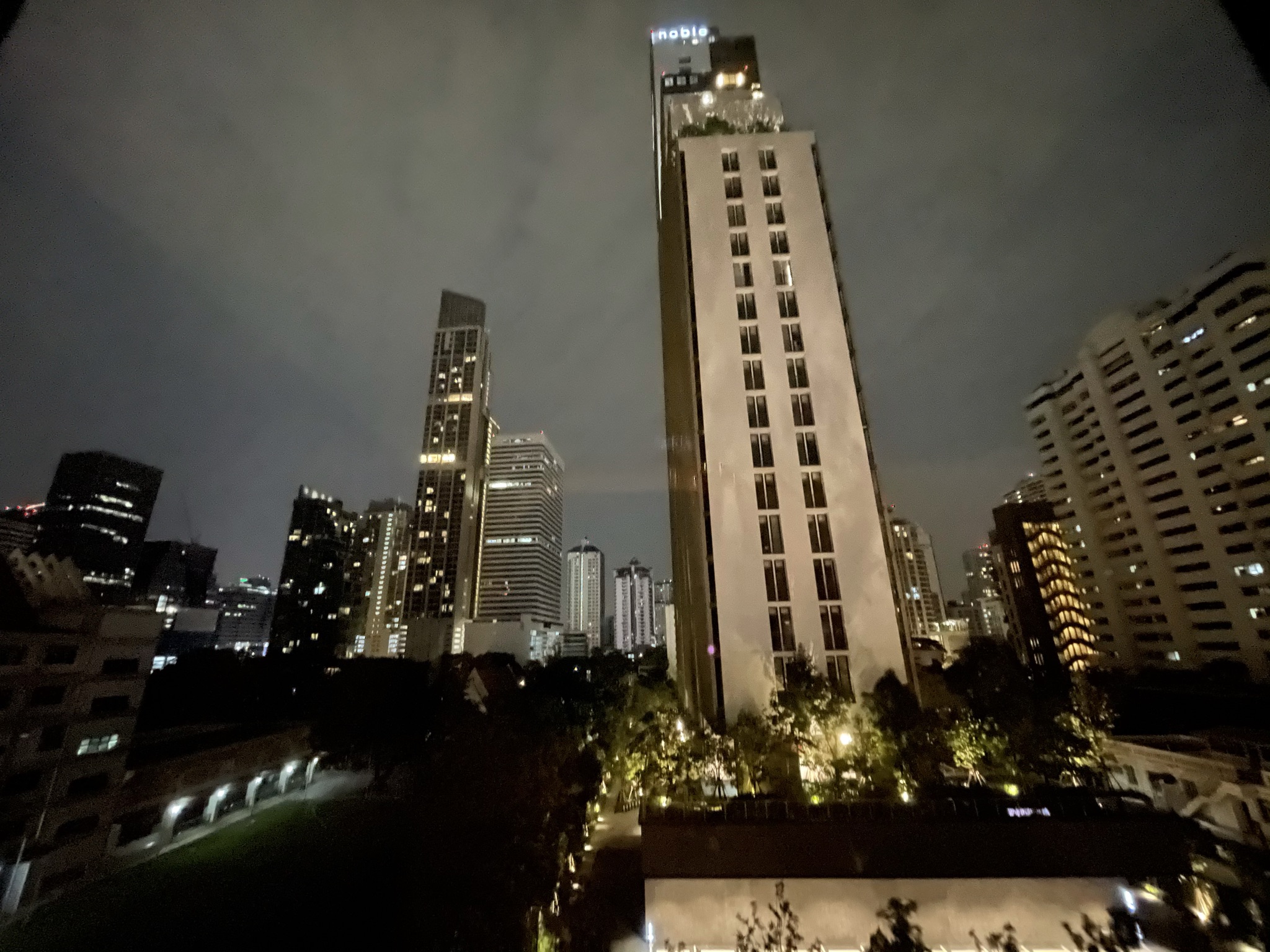Bangkok skyline at night with lit skyscrapers and the Chao Phraya River