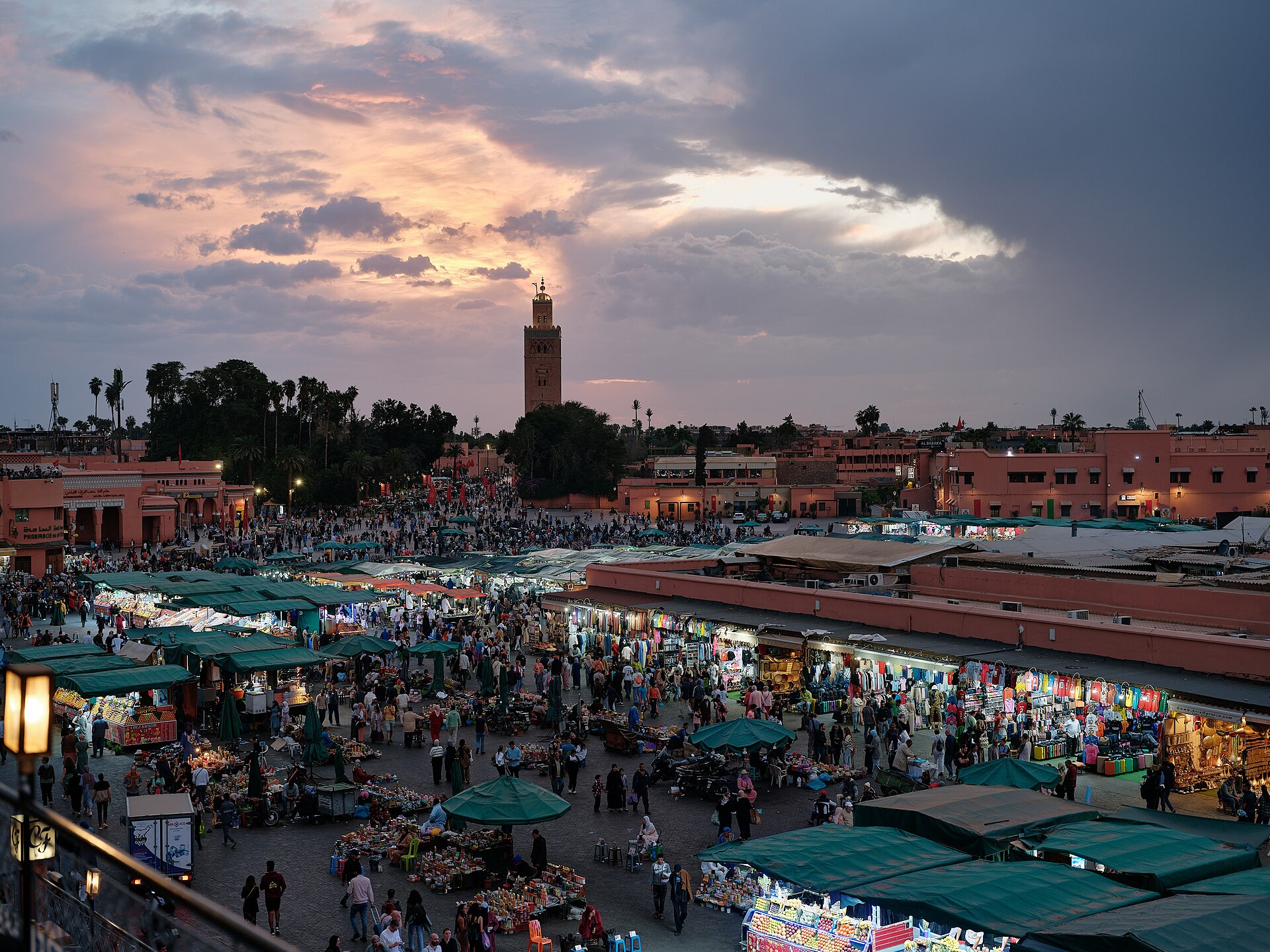 Jemaa el-Fnaa square in Marrakech at sunset with food stalls and crowds