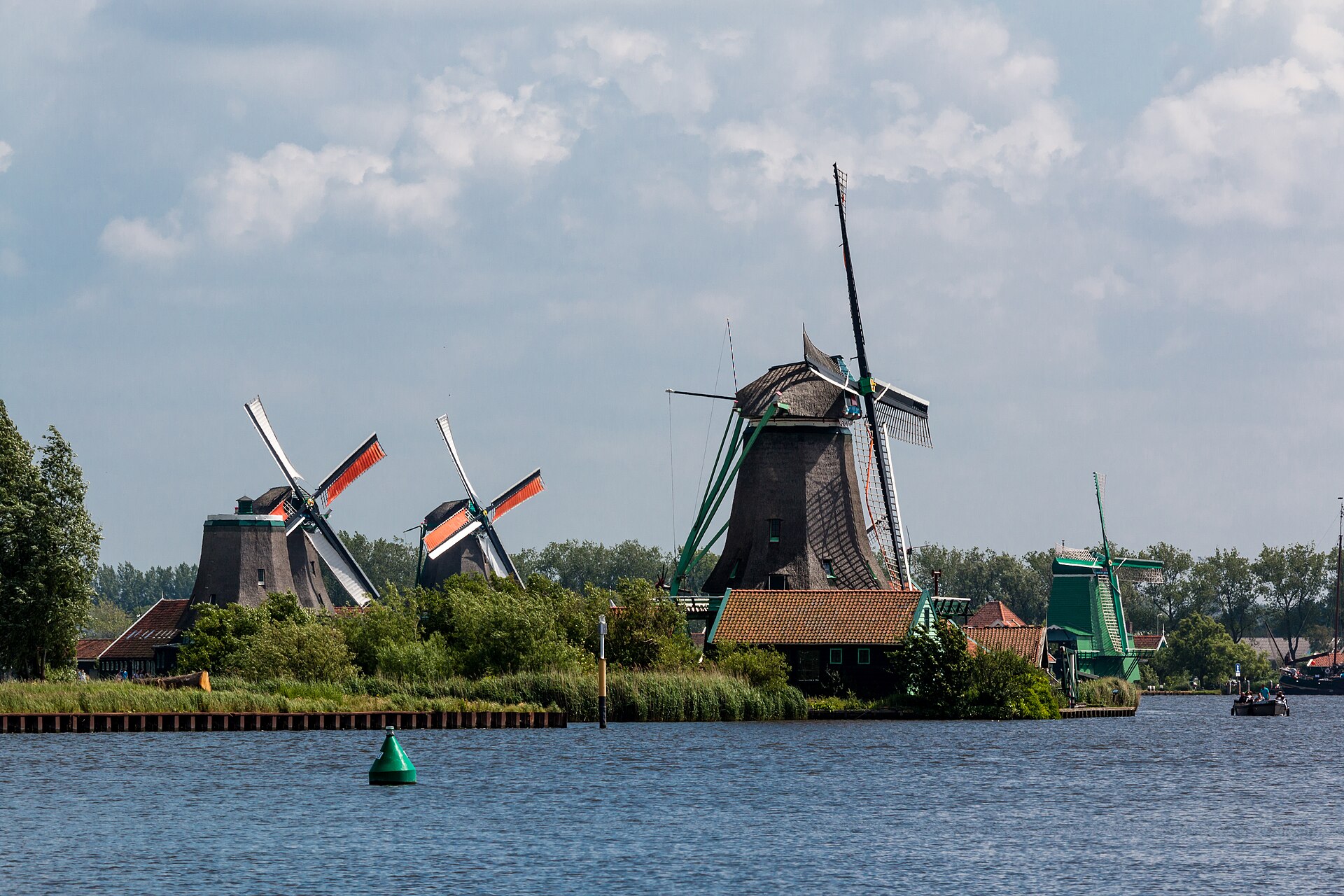 Working windmills along the river at Zaanse Schans near Amsterdam