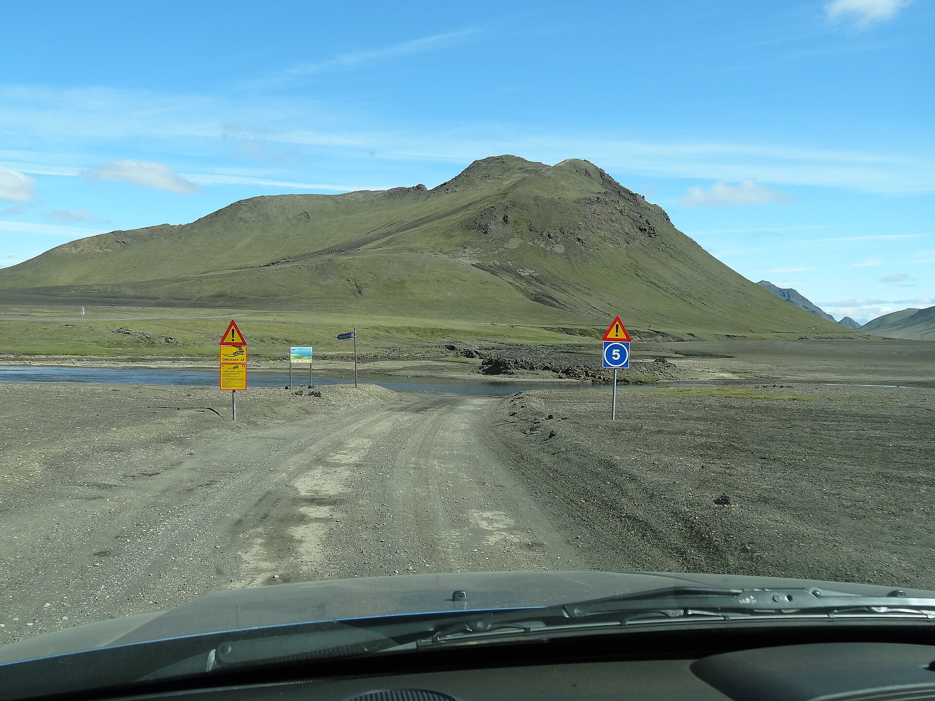 Gravel F-road mountain track leading into the Icelandic Highlands