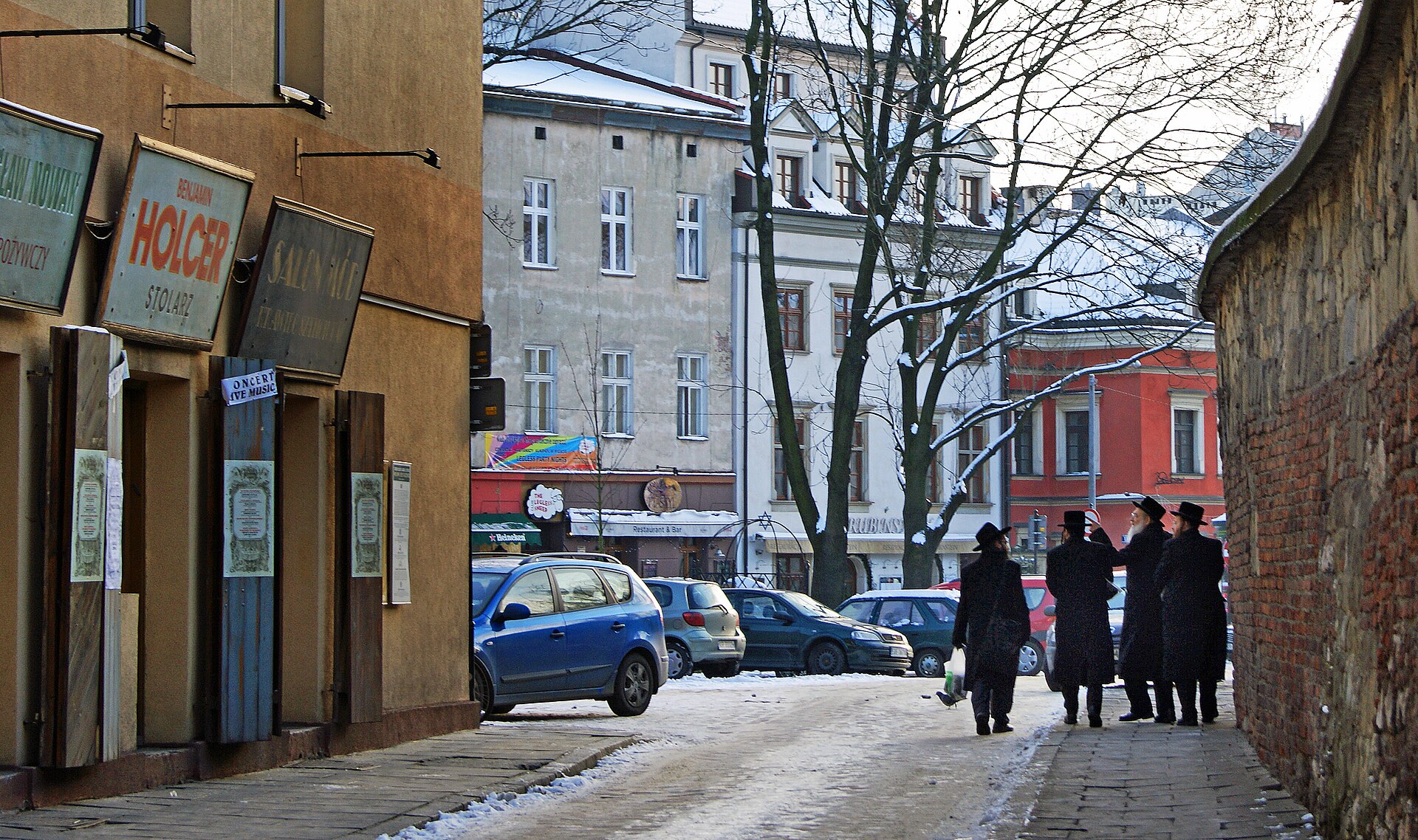 Szeroka Street in Krakow's Kazimierz Jewish quarter, lined with historic tenement houses
