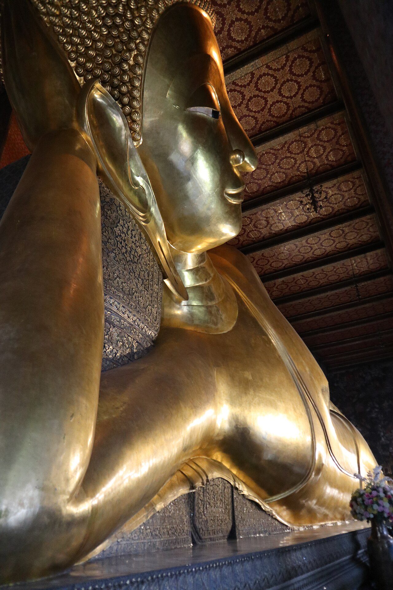 The gold Reclining Buddha statue inside Wat Pho, Bangkok