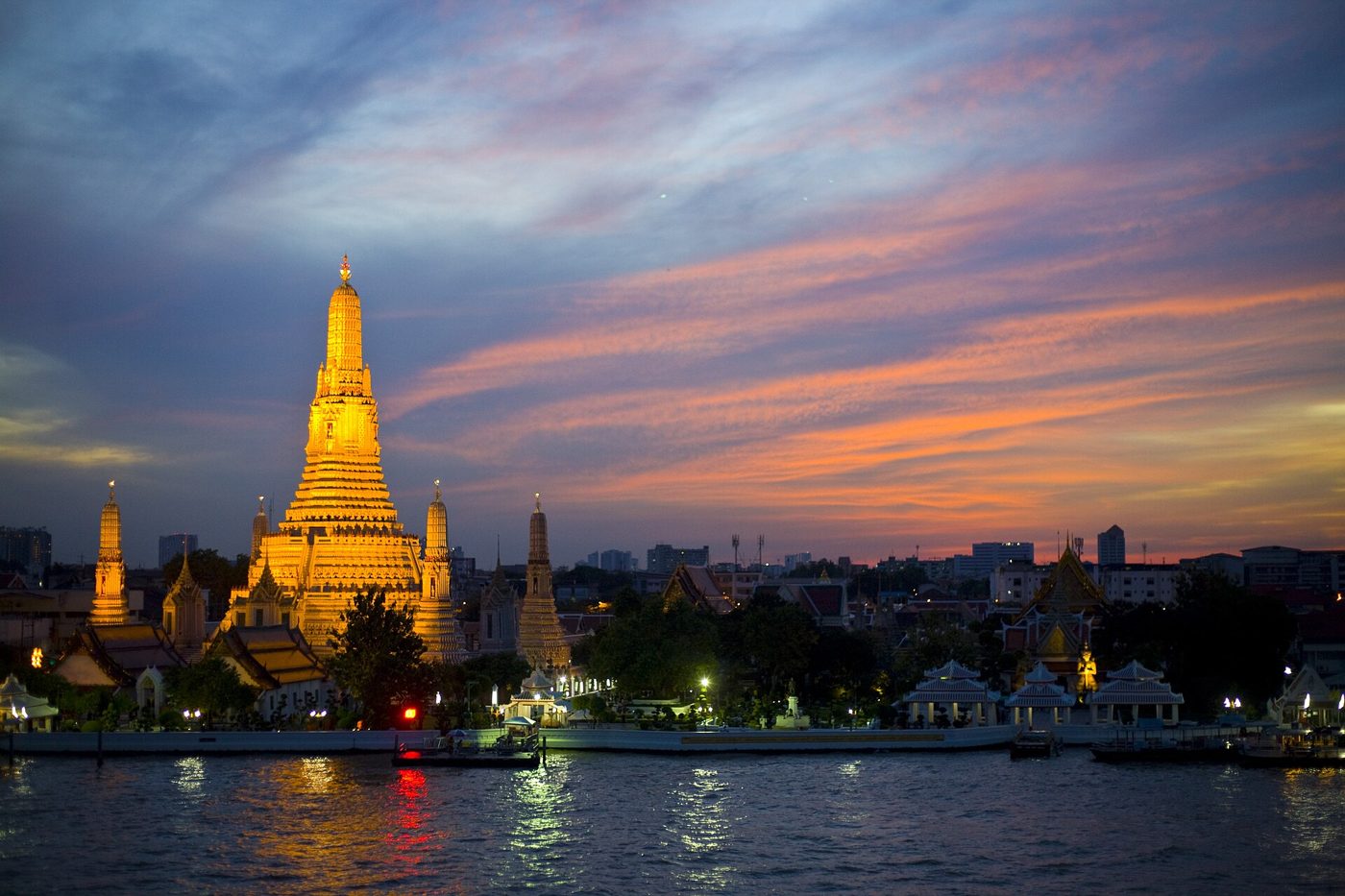 Wat Arun, the Temple of Dawn, at sunset across the Chao Phraya River in Bangkok