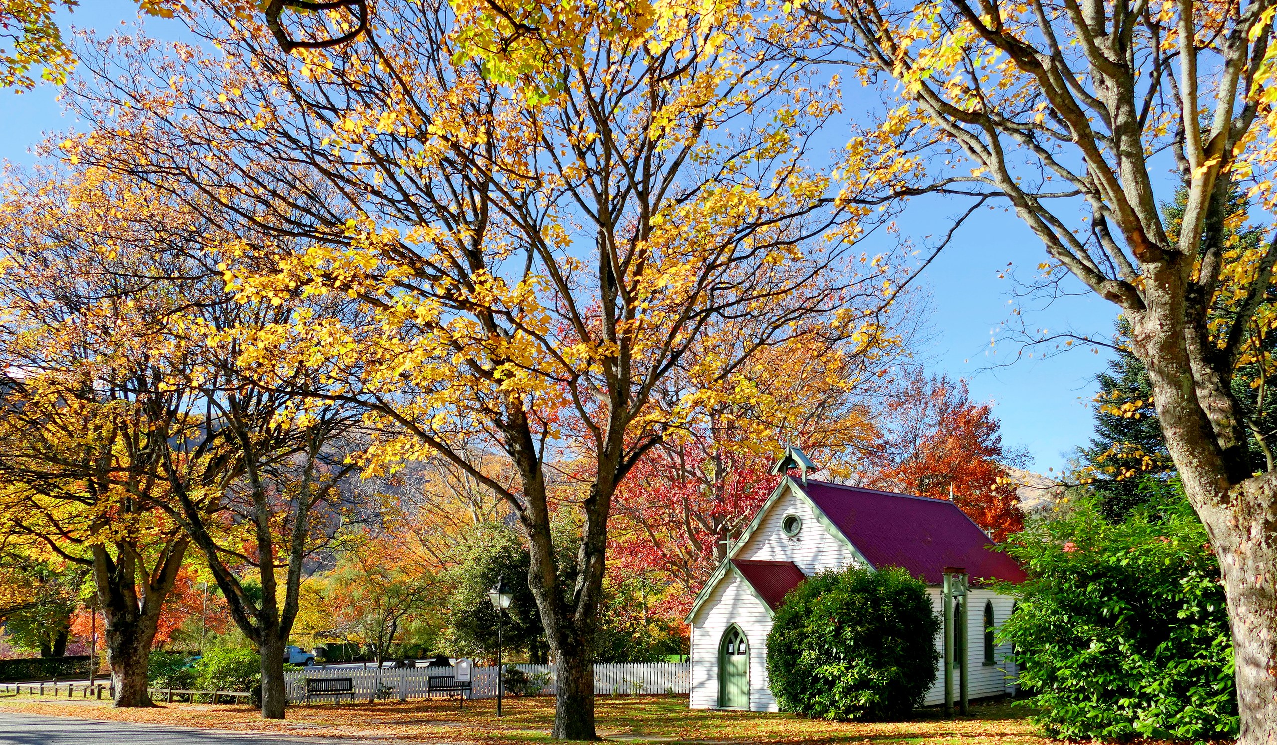 St Paul's church in Arrowtown with autumn foliage