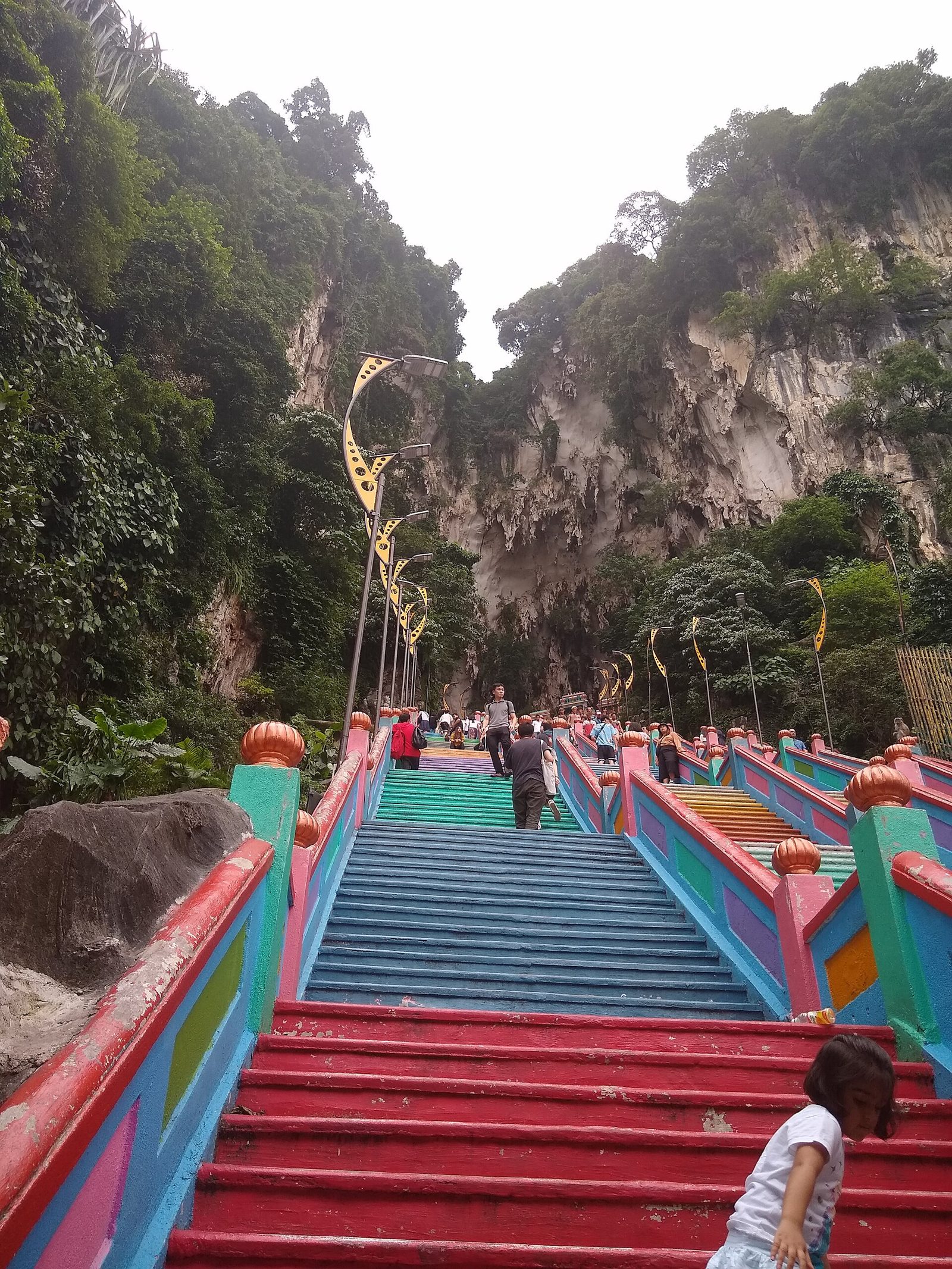 Rainbow-painted stairs climbing to the Temple Cave at Batu Caves