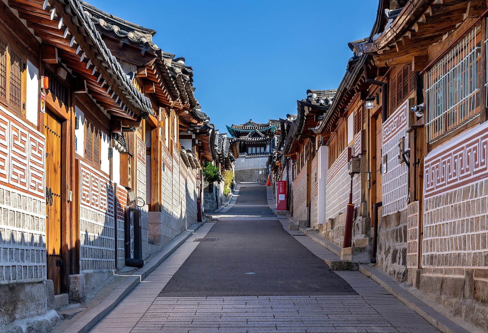 Traditional hanok houses on a street in Bukchon Hanok Village, Seoul