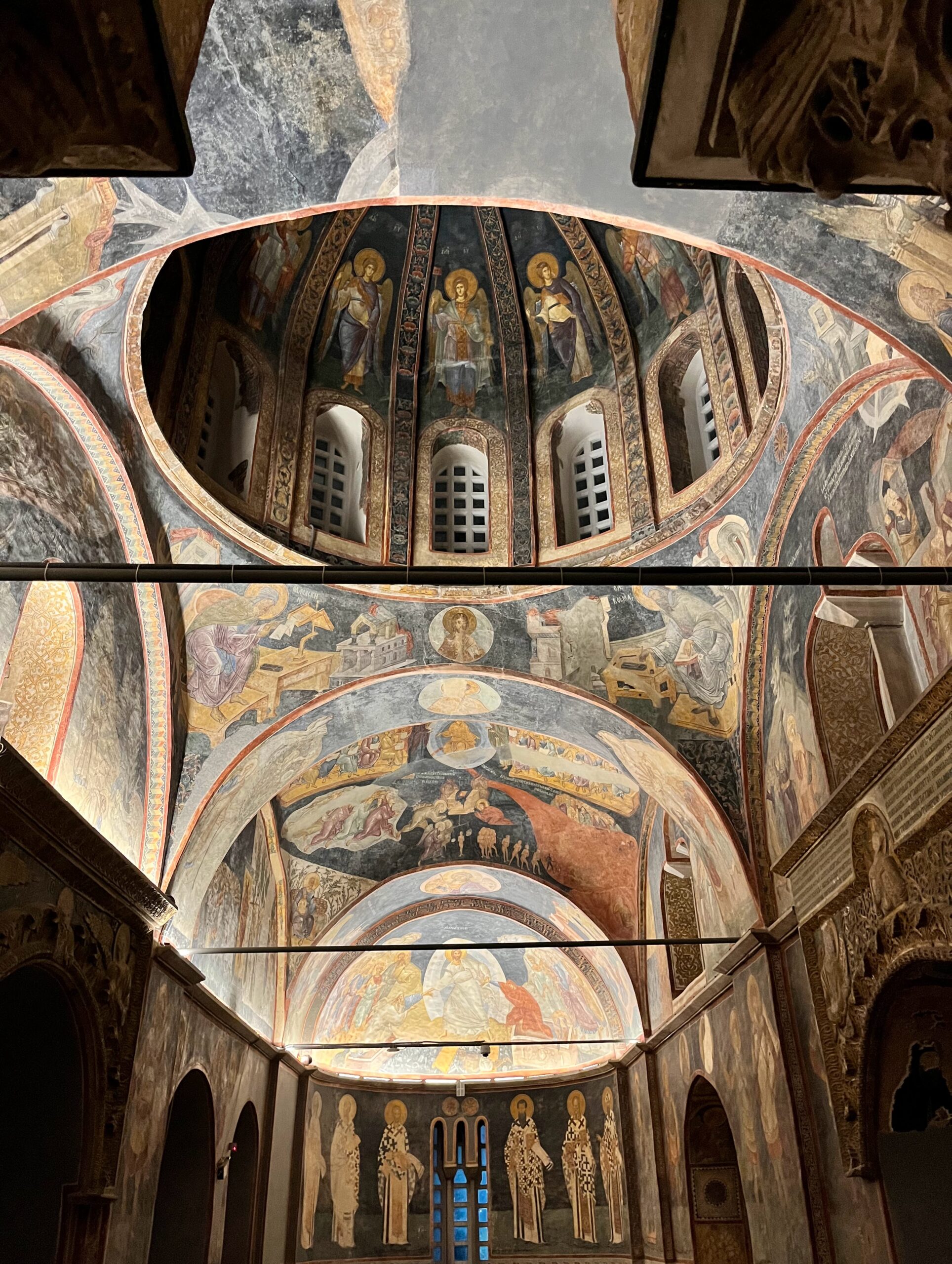 Golden Byzantine mosaics of saints and biblical scenes cover the interior walls of the Kariye (Chora) Mosque in Istanbul.