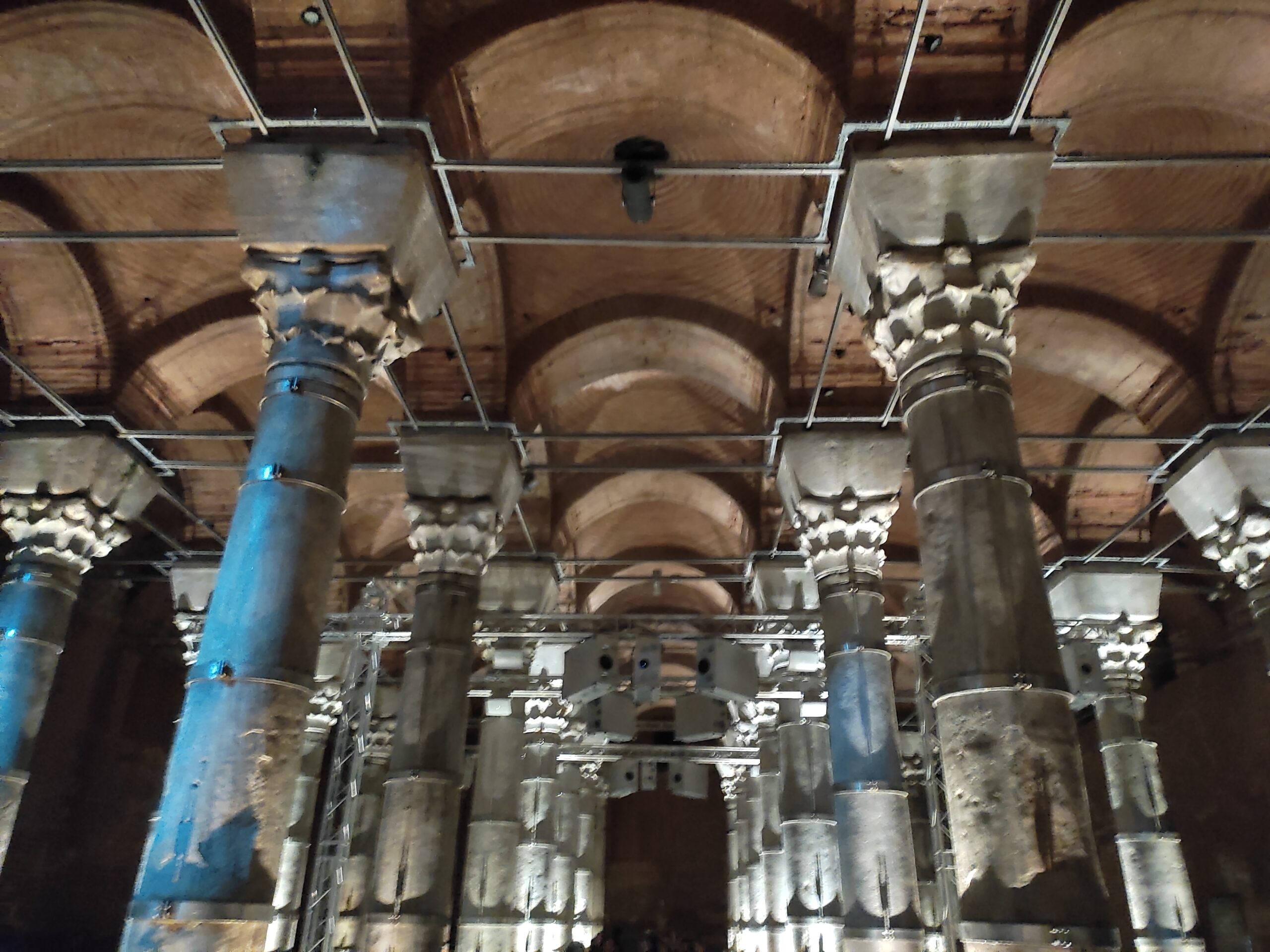 Rows of ancient brick columns reflected in shallow water inside the Theodosius Cistern beneath Istanbul.