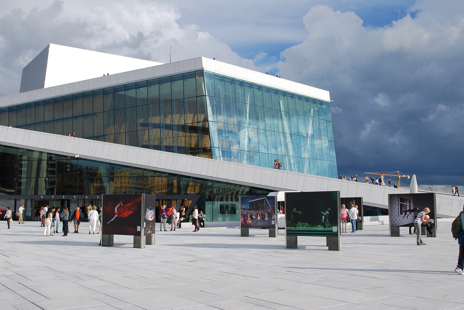 The white marble Oslo Opera House sloping down to the water in Bjørvika