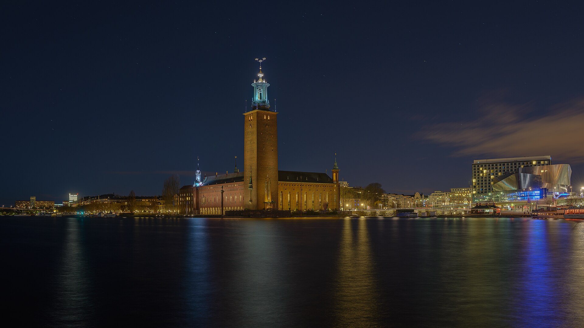 Stockholm City Hall with its tall tower, seen across the water