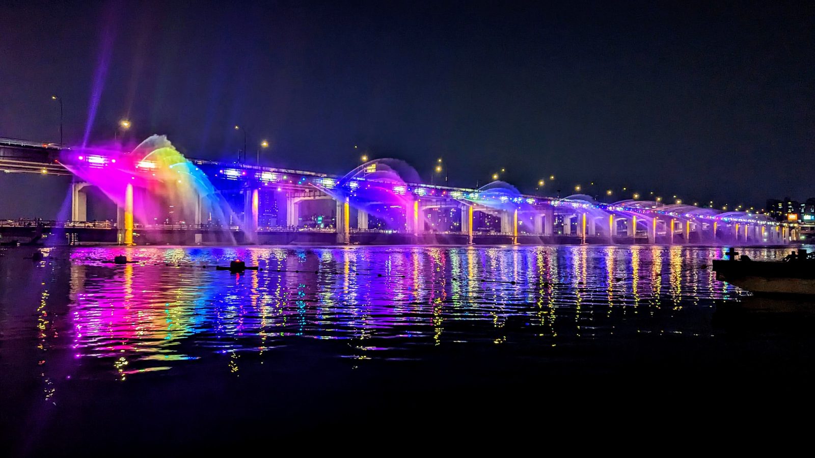 Banpo Bridge Moonlight Rainbow Fountain lit up at night over the Han River in Seoul