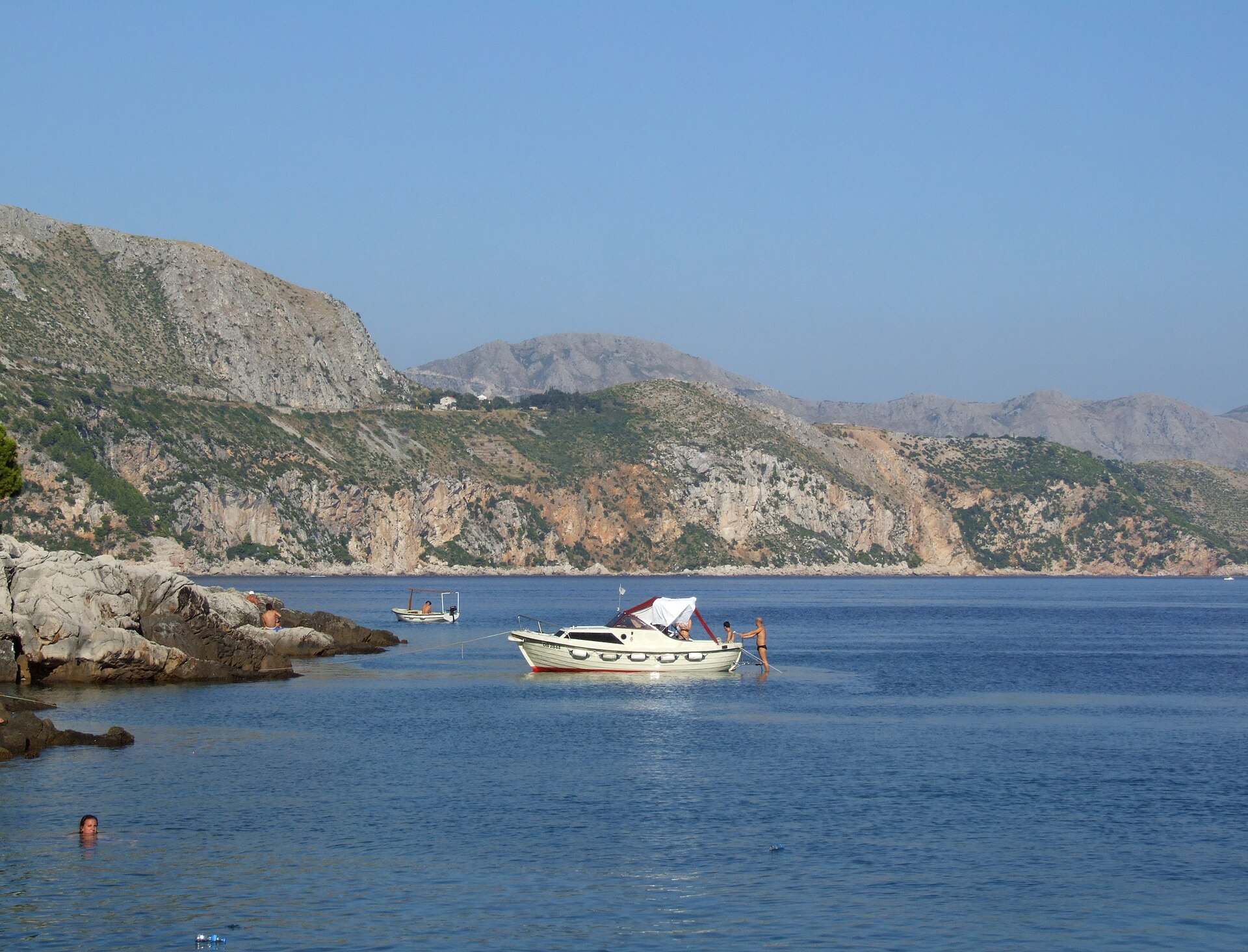 Boats anchored in a calm cove near Lokrum island off Dubrovnik