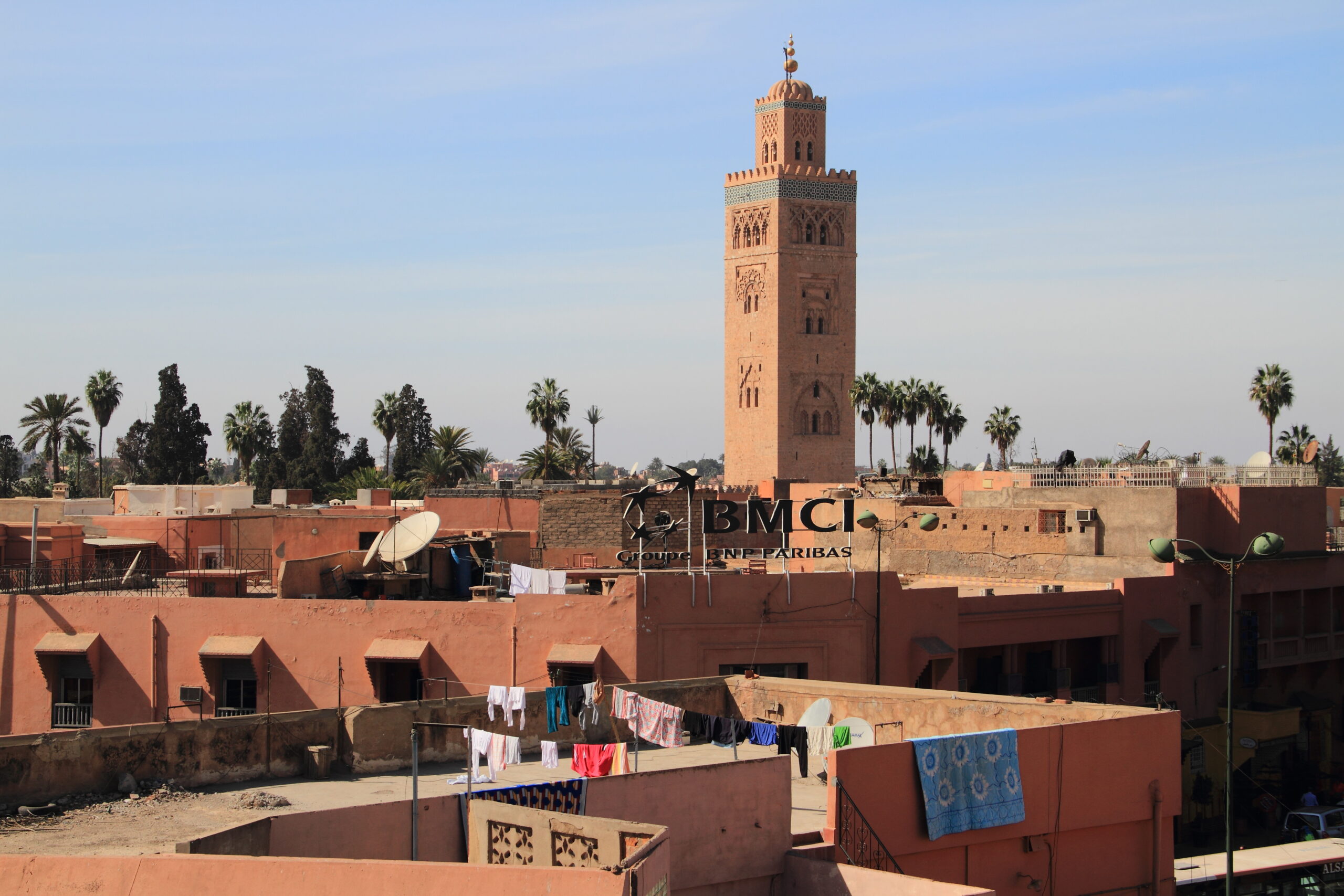 The Koutoubia Mosque minaret rises above the rooftops of the Marrakech medina.