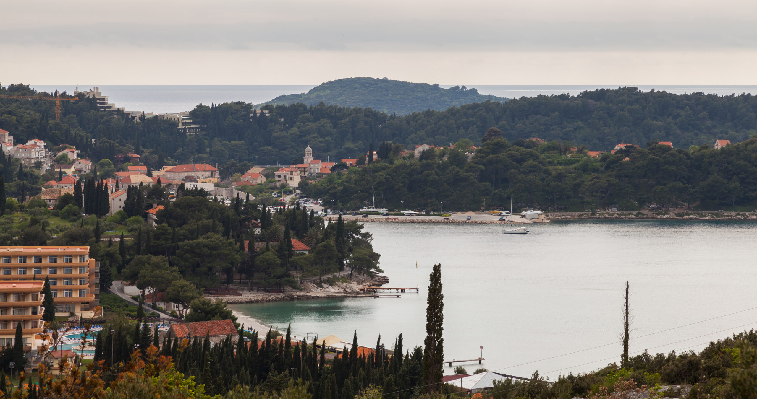 Cavtat harbor with boats and waterfront promenade on the Croatian coast