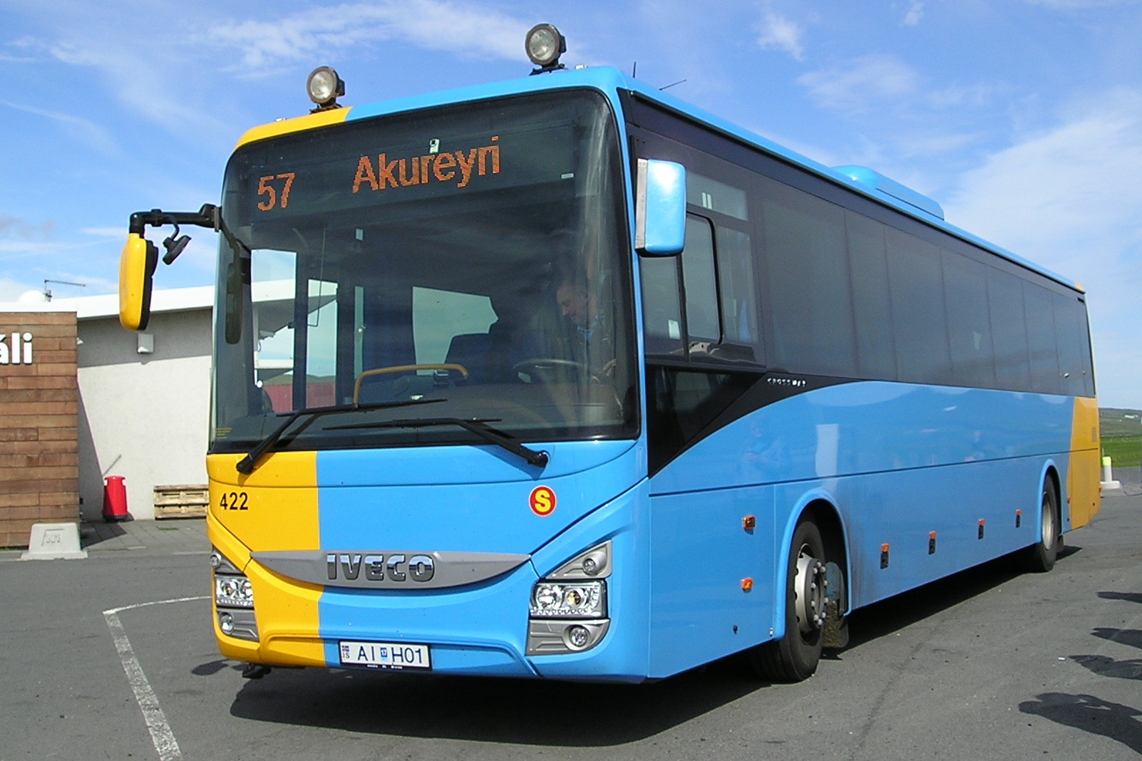 Yellow Strætó public bus on an Icelandic road