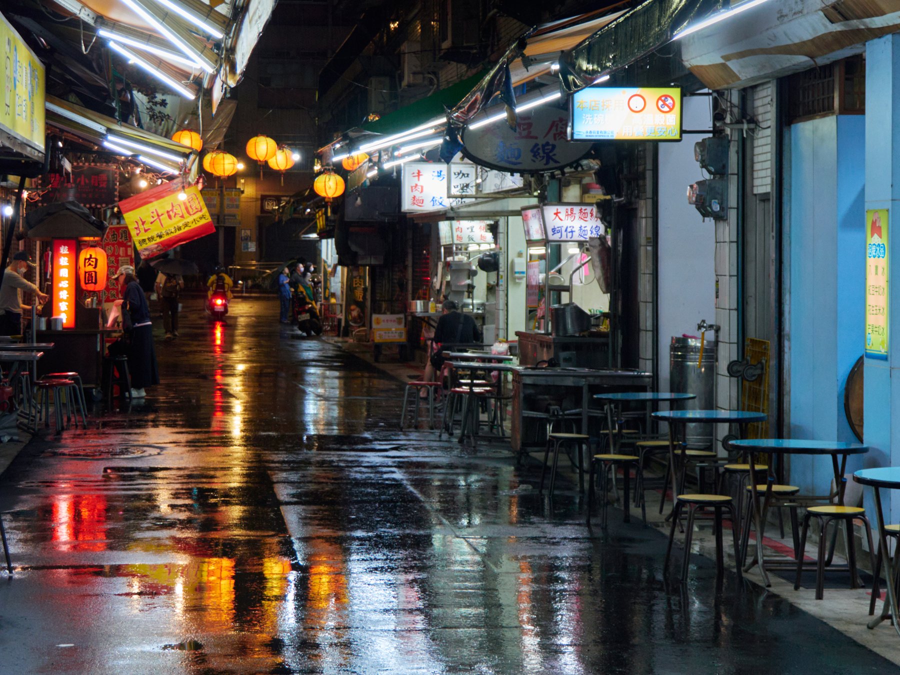 A busy Taipei night market with food stalls and crowds in Taiwan