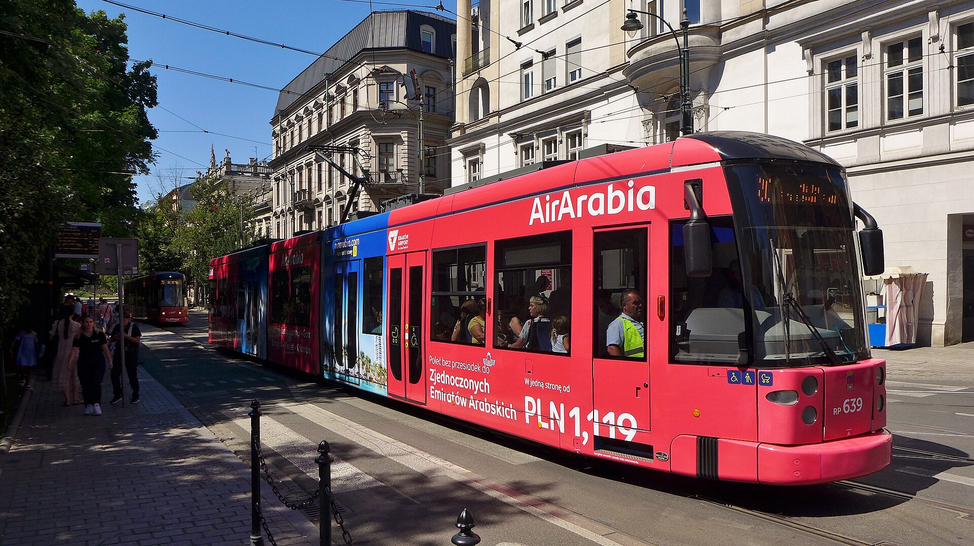 A modern Krakow tram at the Stary Kleparz stop on Basztowa Street near the Old Town