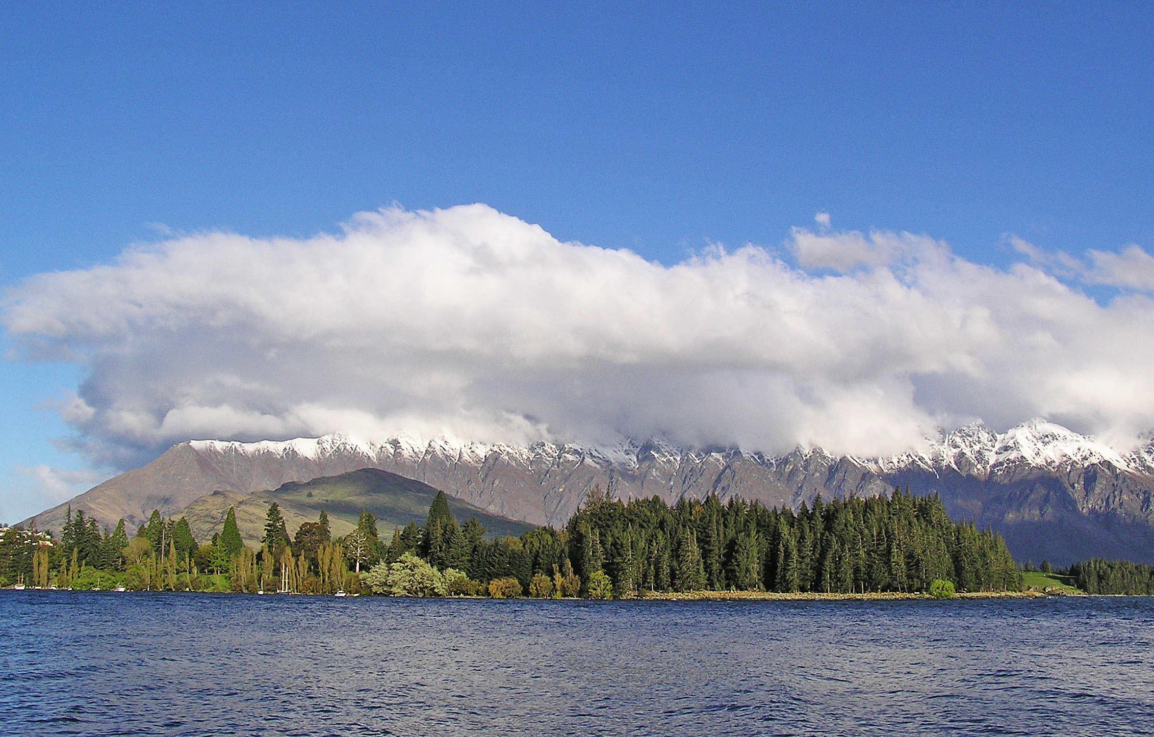 Snow-capped Remarkables mountains across Lake Wakatipu from Frankton Road