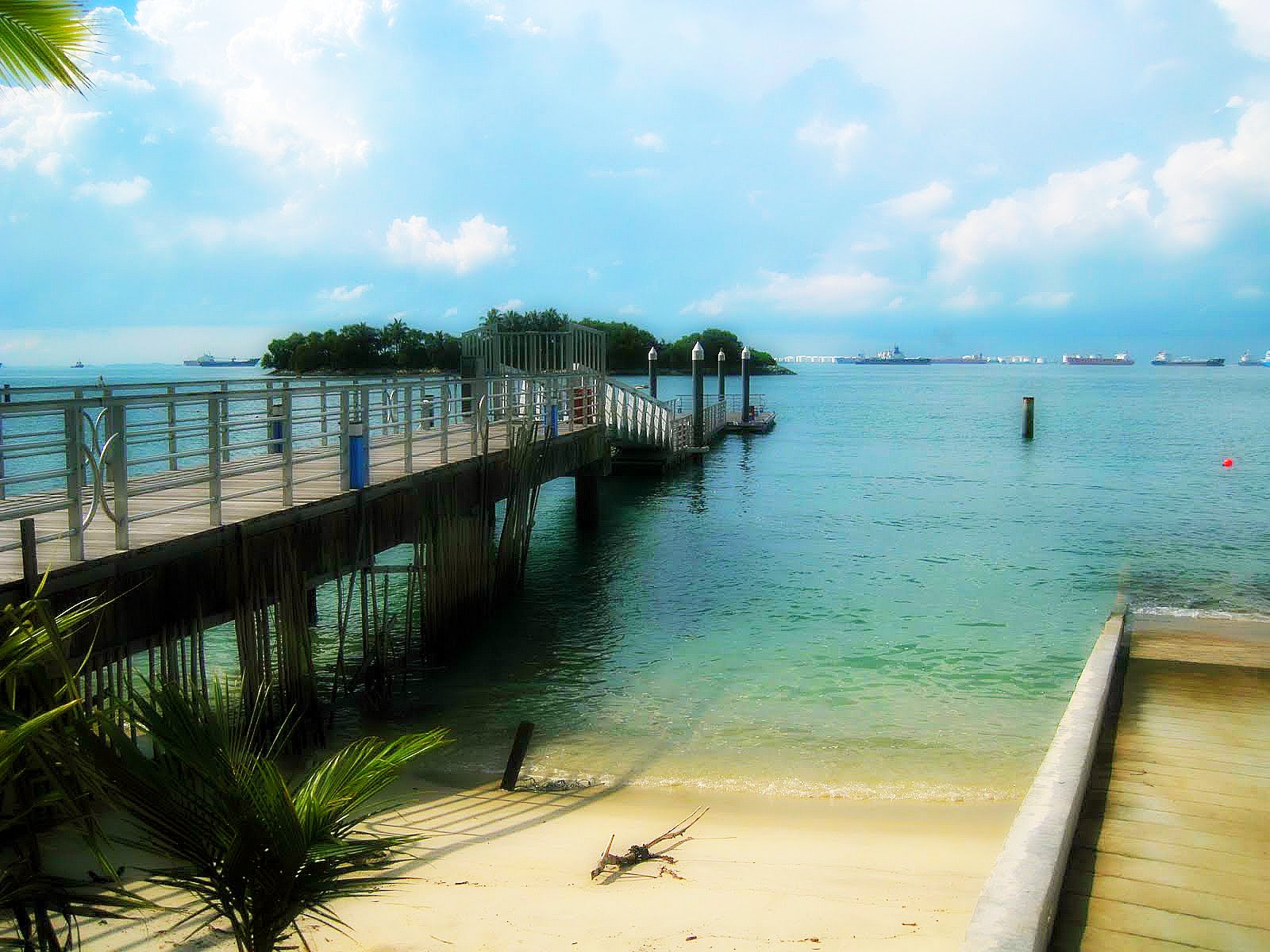 Siloso Beach Sentosa Island Singapore boardwalk over calm water