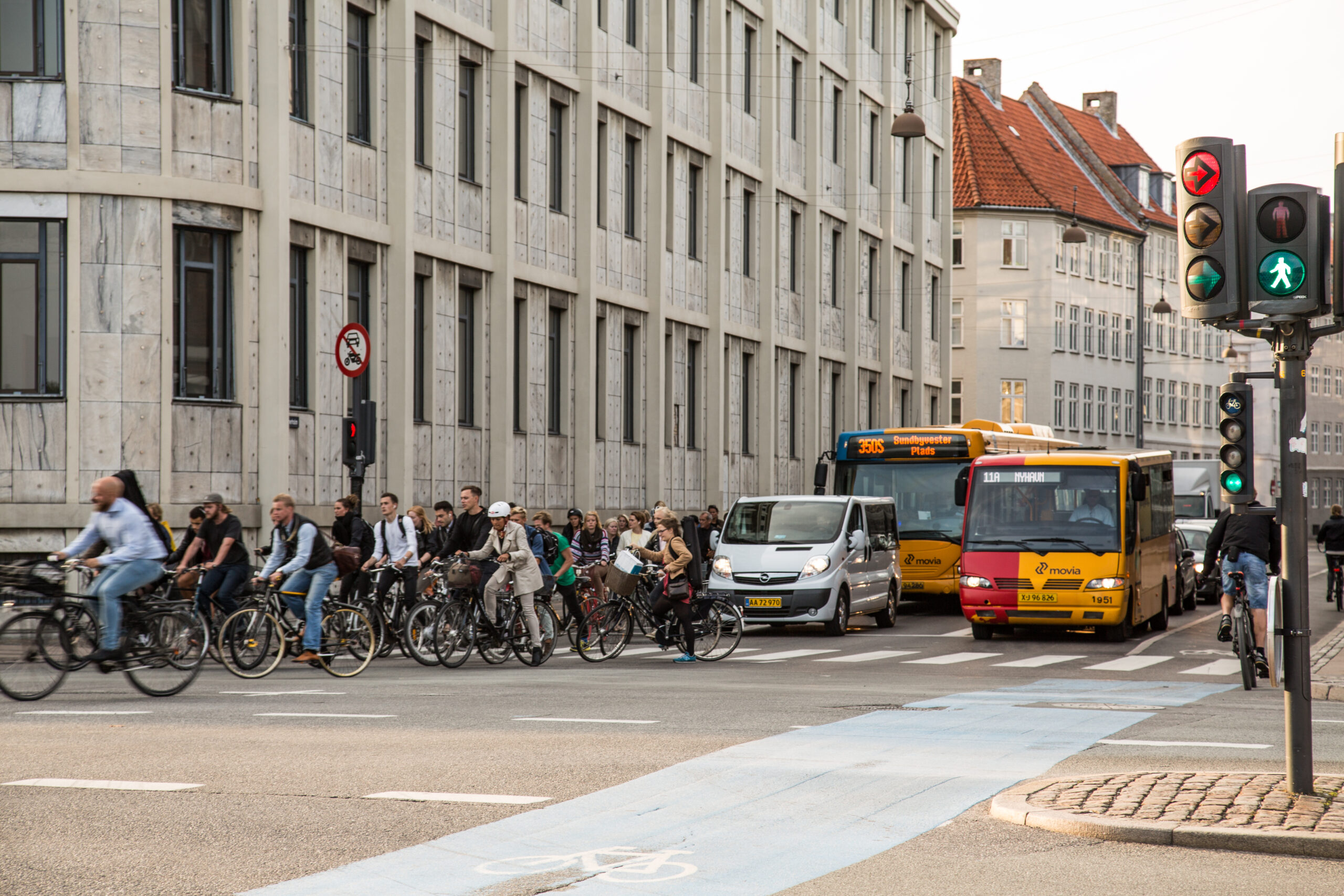 Cyclists riding through central Copenhagen, Denmark