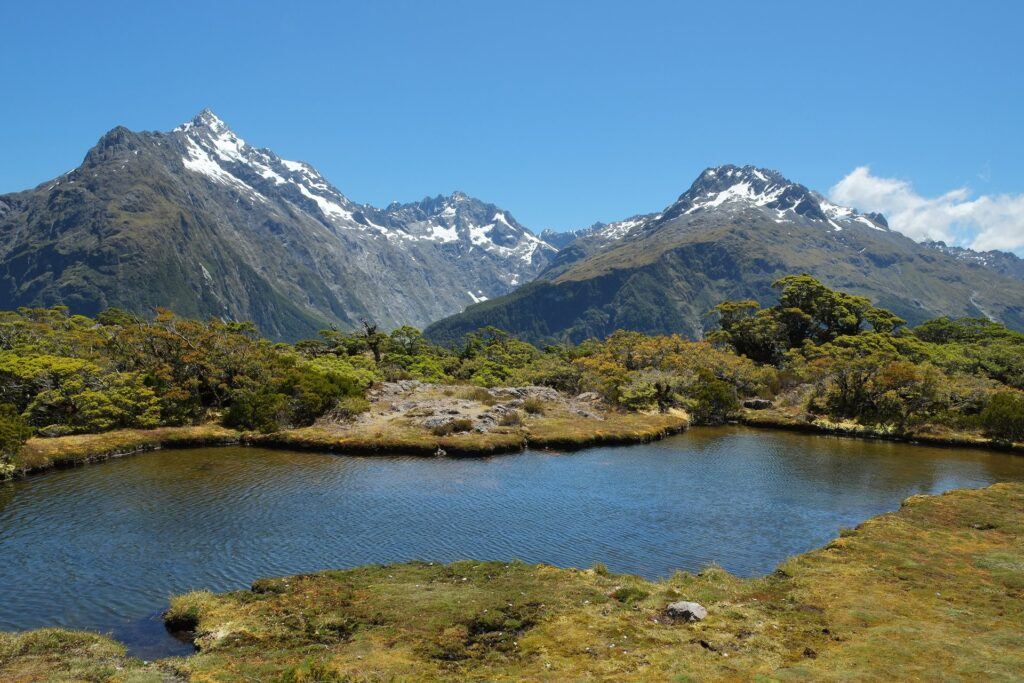 Alpine tarn at Key Summit on the Routeburn Track with Fiordland peaks behind