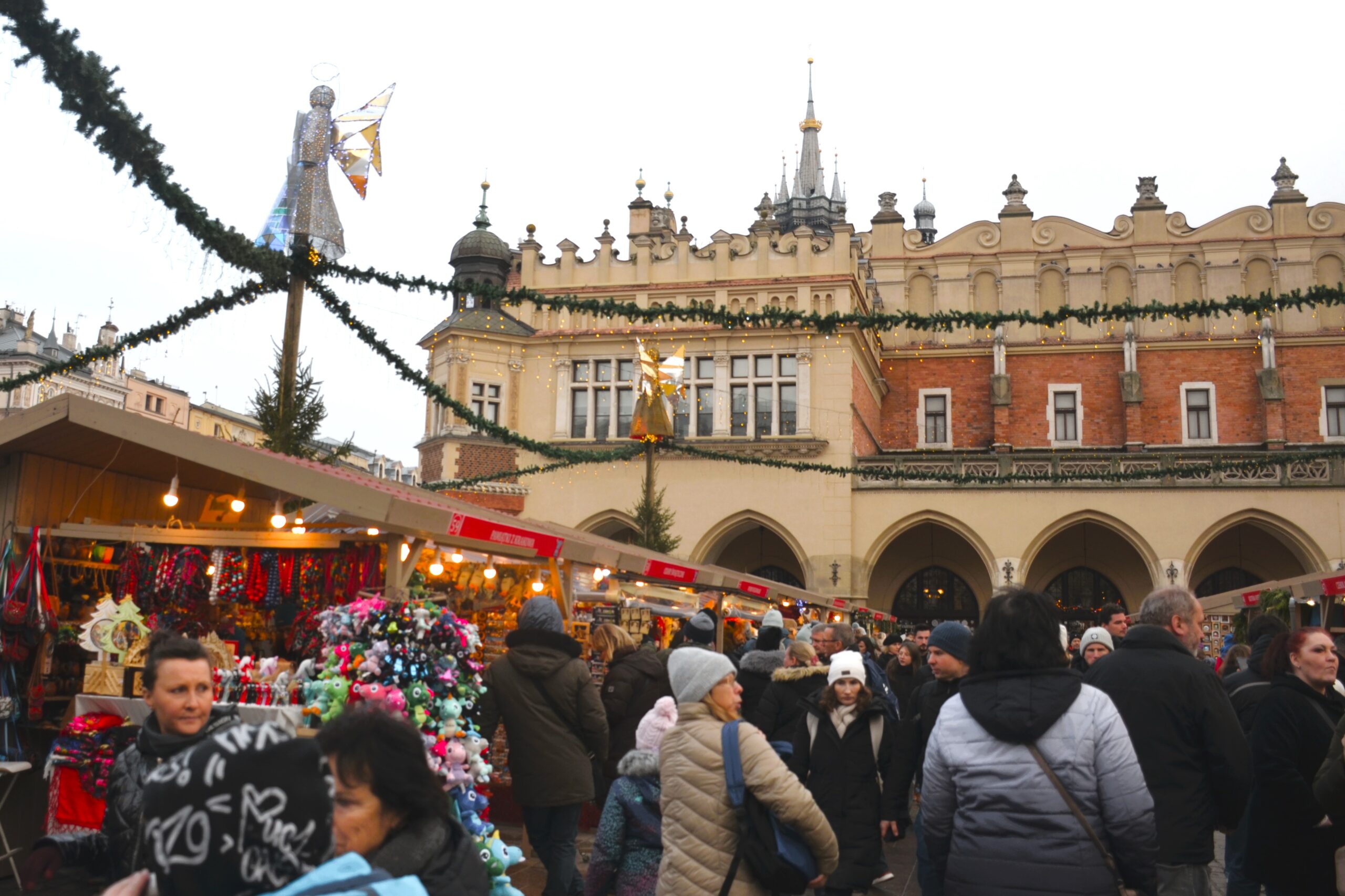 Christmas market stalls with the Cloth Hall in Krakow's Main Market Square