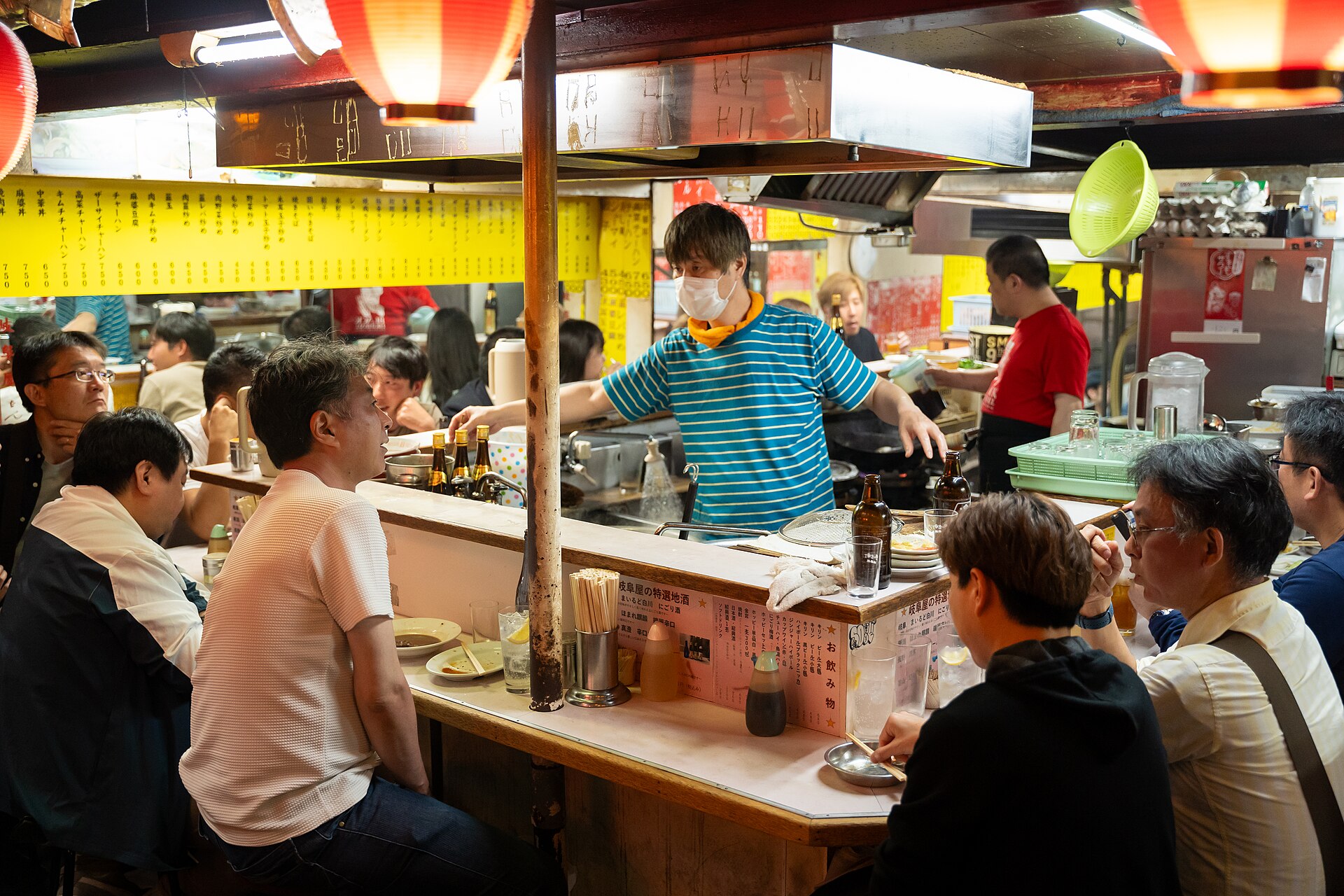 Lantern-lit yakitori stalls glowing at night in Omoide Yokocho, Shinjuku