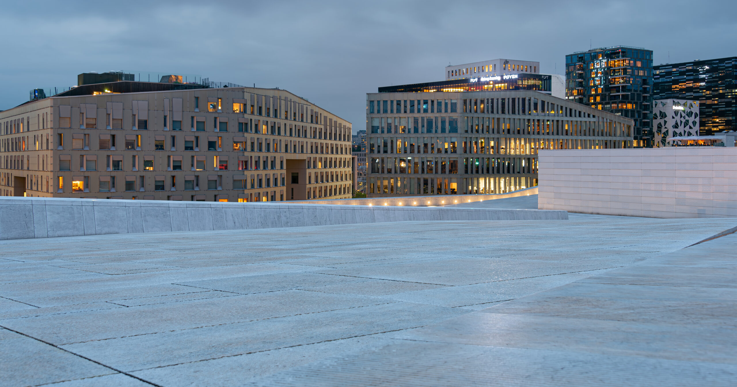 Oslo Opera House rising from the fjord waterfront at Bjørvika
