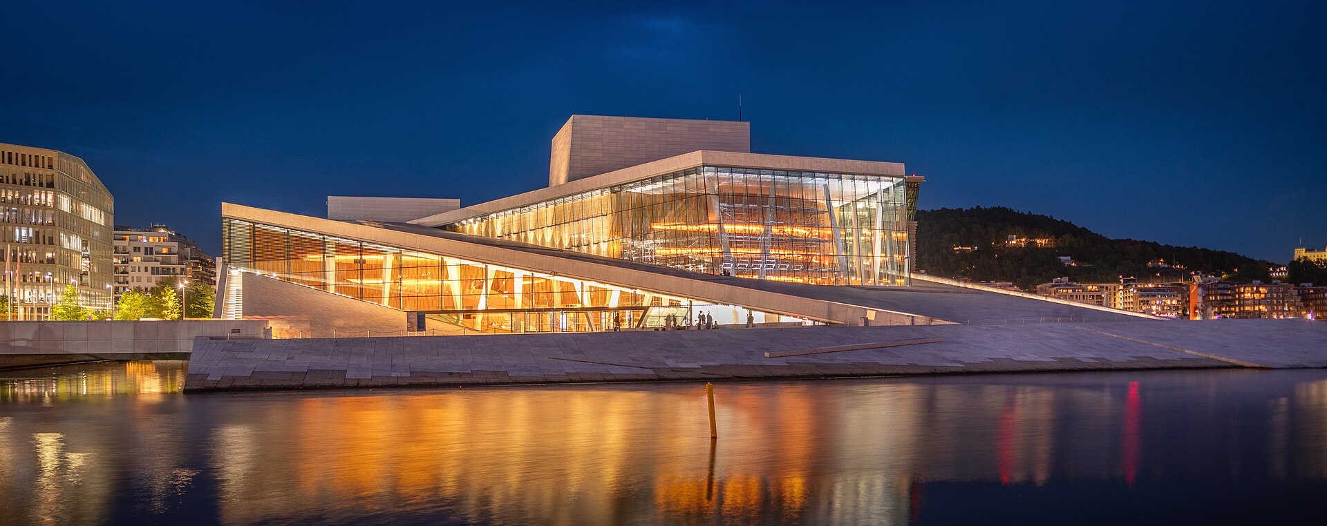 The Oslo Opera House rising from the Oslofjord at Bjørvika